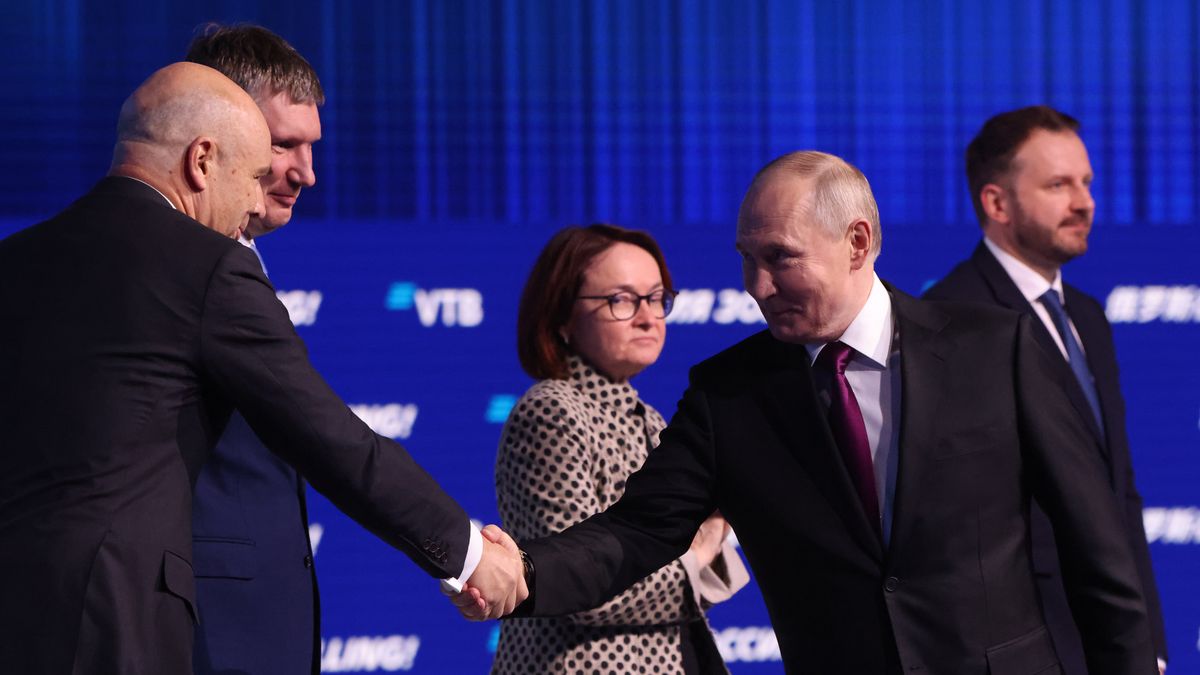 MOSCOW, RUSSIA - DECEMBER 2: Russian President Vladimir Putin (C) shakes hands with Finance Miister Anton Siluanov (L) as Economic Development Minister Maxim Resehtikov (2L),  Central Bank Chairwoman Elvira Nabiullina (3L) and Presidential Administration Deputy Chief Maxim Oreshkin (R) looks on during the VTB Investment Forum 'Russia Calling!', on December 2, 2025 in Moscow, Russia. Putin visited an annual forum, hosted by the VTB Group, prior his talk with US special envoy Steve Witkoff. (Photo by Contributor/Getty Images)