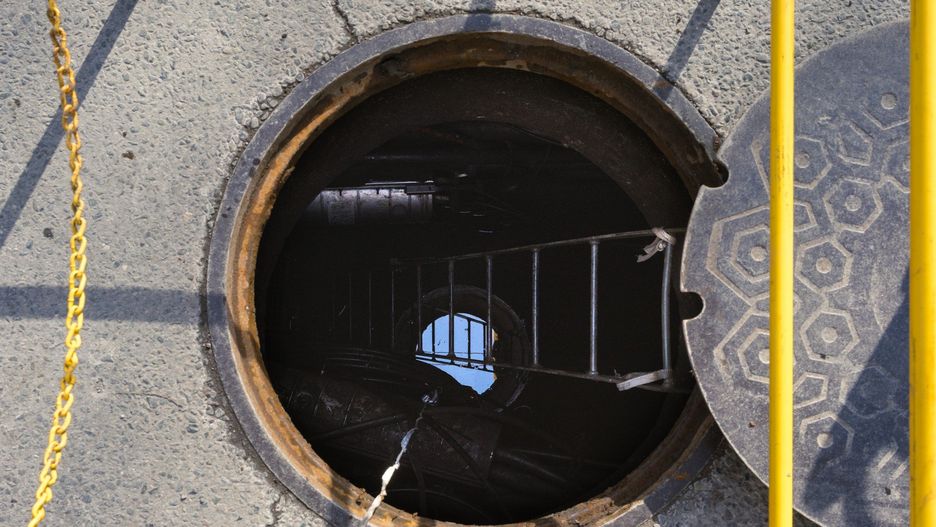 An open manhole on a city street