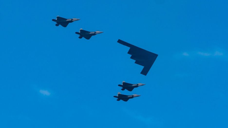NEW YORK, NEW YORK - JULY 04: A B-2 Spirit and F-22 fighter jets fly over Lower Manhattan during the Fourth of July Military Flyover on July 04, 2020 in New York City. (Photo by Gotham/Getty Images)