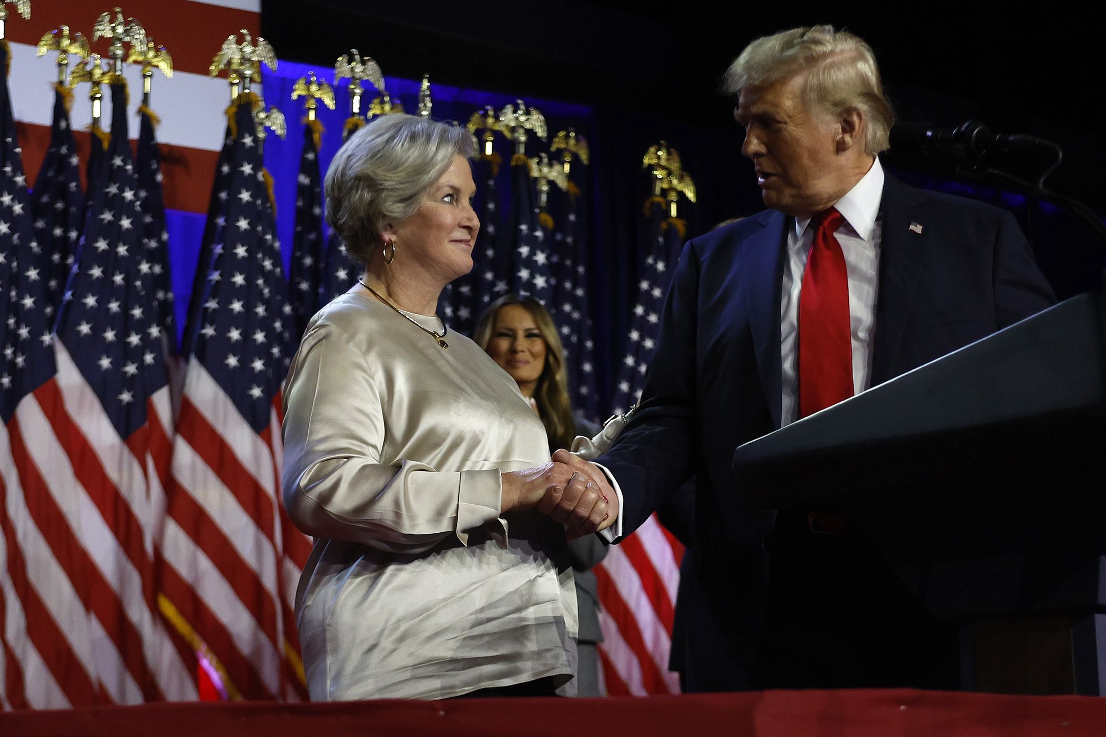WEST PALM BEACH, FLORIDA - NOVEMBER 05: Republican presidential nominee, former U.S. President Donald Trump praises his campaign senior advisor Susie Wiles during an election night event at the Palm Beach Convention Center on November 06, 2024 in West Palm Beach, Florida. Americans cast their ballots today in the presidential race between Republican nominee former President Donald Trump and Vice President Kamala Harris, as well as multiple state elections that will determine the balance of power in Congress. (Photo by Chip Somodevilla/Getty Images)