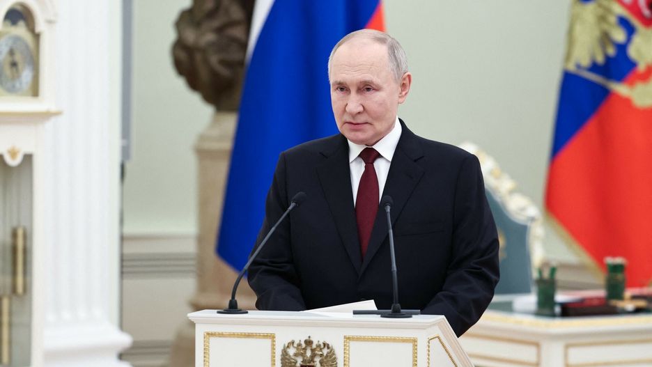 Temporary
In this pool photograph distributed by the Russian state agency Sputnik, Russia's President Vladimir Putin gives a speech at a ceremony to award servicemen with Gold Star medals of "Hero of Russia" on Defender of the Fatherland Day at the Kremlin in Moscow on February 23, 2025. (Photo by Alexander KAZAKOV / POOL / AFP)
ALEXANDER KAZAKOV