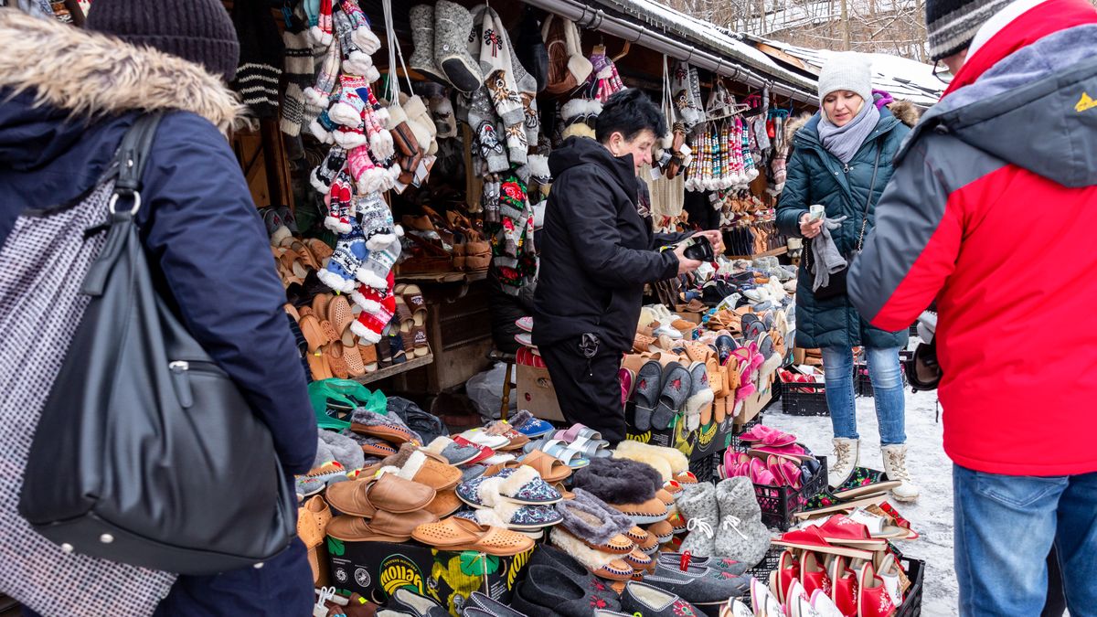 ZAKOPANE, MALOPOLSKIE, POLAND - 2024/01/19: People buy traditional leather slippers in an open market space at the foot of Gubalowka mountain in the center of Zakopane, a popular Tatra mountain holiday resort. (Photo by Dominika Zarzycka/SOPA Images/LightRocket via Getty Images)