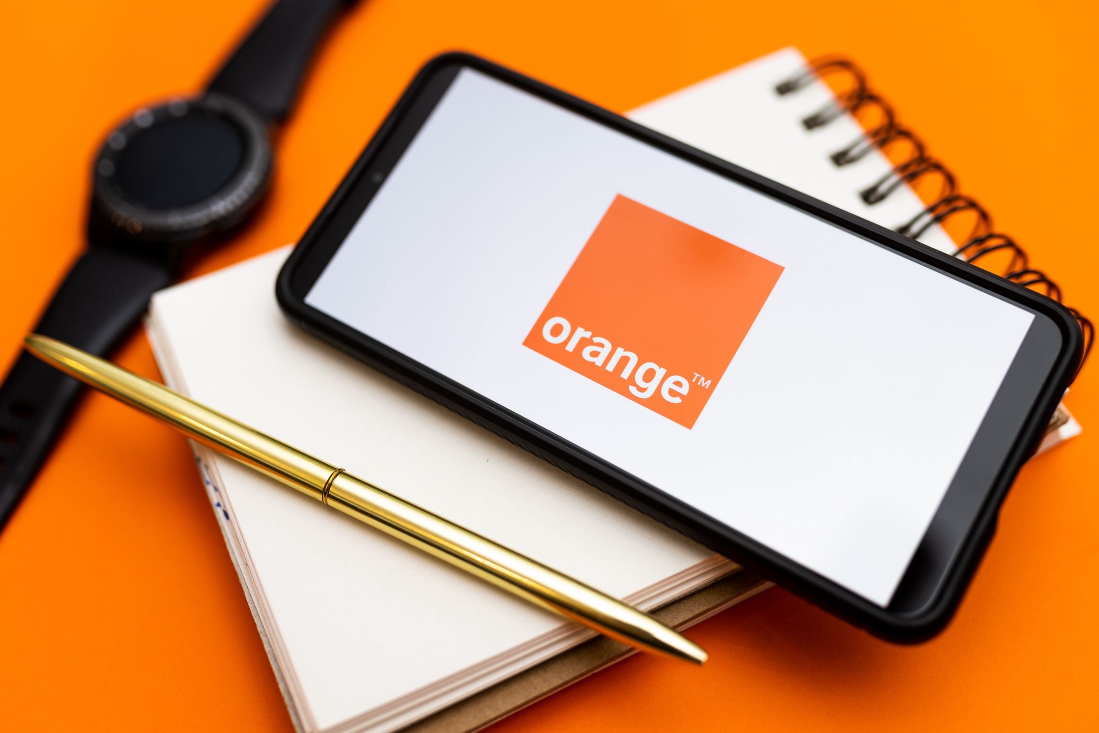 POLAND - 2022/12/07: In this photo illustration an Orange logo seen displayed on a smartphone. (Photo Illustration by Mateusz Slodkowski/SOPA Images/LightRocket via Getty Images)