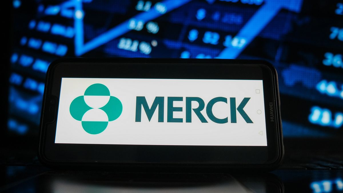 In this photo illustration a Merck logo seen displayed on aPOLAND - 2021/02/05: In this photo illustration a Merck logo seen displayed on a smartphone screen with stock market graphic on the background. (Photo Illustration by Omar Marques/SOPA Images/LightRocket via Getty Images)SOPA Imagesmerck, logos, brand, online, smartphone, cellphone, phone, device, stock market, stock exchange, stock price, graphic