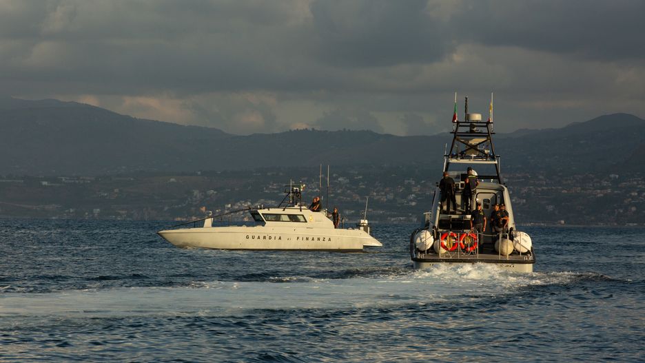 Two Guardia di Finanza vessels during search operations for the luxury yacht Bayesian which sank off the coast of Porticello, Sicily, on Wednesday, Aug. 21, 2024. Italian search and rescue teams have retrieved a fifth body from a sunken yacht off Sicily, where British tech tycoon Mike Lynch and Morgan Stanley International chair Jonathan Bloomer are among those feared to have died. Photographer: Antonio Cascio/Bloomberg via Getty Images