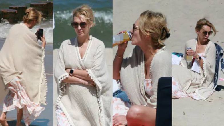 Anna Kalczyńska pije piwo na plaży i fotografuje pociechy