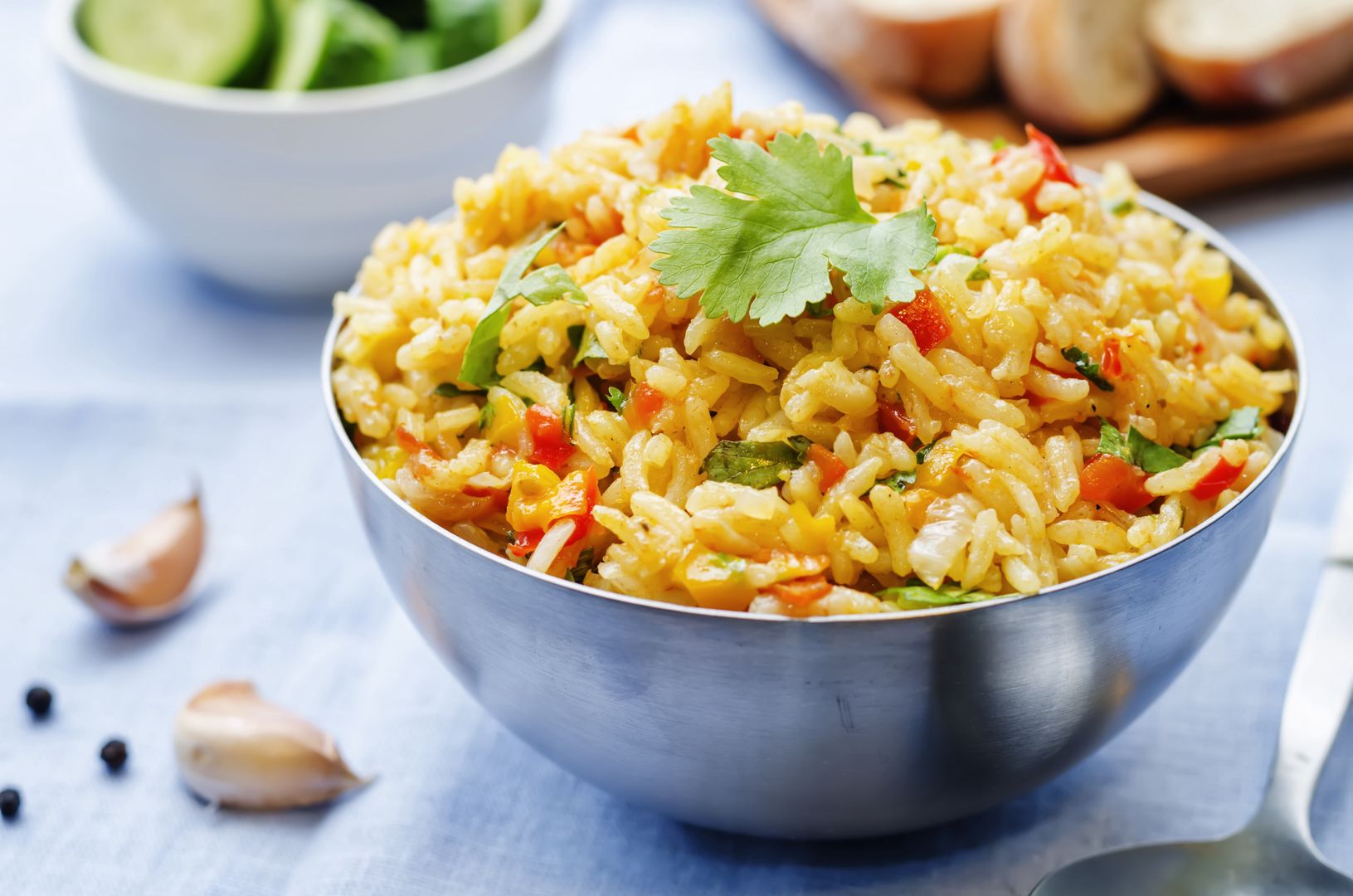 saffron rice with vegetables and cilantro on a blue background. the toning. selective focus Nataliya Arzamasovarice, saffron, herb, curry, pilaf, Indian, pepper, cilantro, snack, sauce, salad, appetizer, Spanish, European, vegetable, garnish, summer, traditional, dinner, fresh, ingredient, homemade, food, dish, vegetarian, lunch, aubergine, prepared, mediterranean, colorful, tasty, arabian, mixed, tasteful, healthy, vegan, ramadan, dark, wooden, rustic, Jewish, rice, closeup, nobody