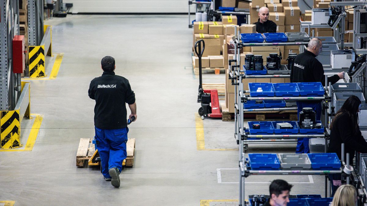 Employees pack and transport orders in the warehouse at the BioTech USA Kft. manufacturing plant in Szada, Hungary, on Wednesday, Jan. 24, 2024. BioTech USA is one of Europe's largest manufacturers of food supplements. Photographer: Akos Stiller/Bloomberg via Getty Images