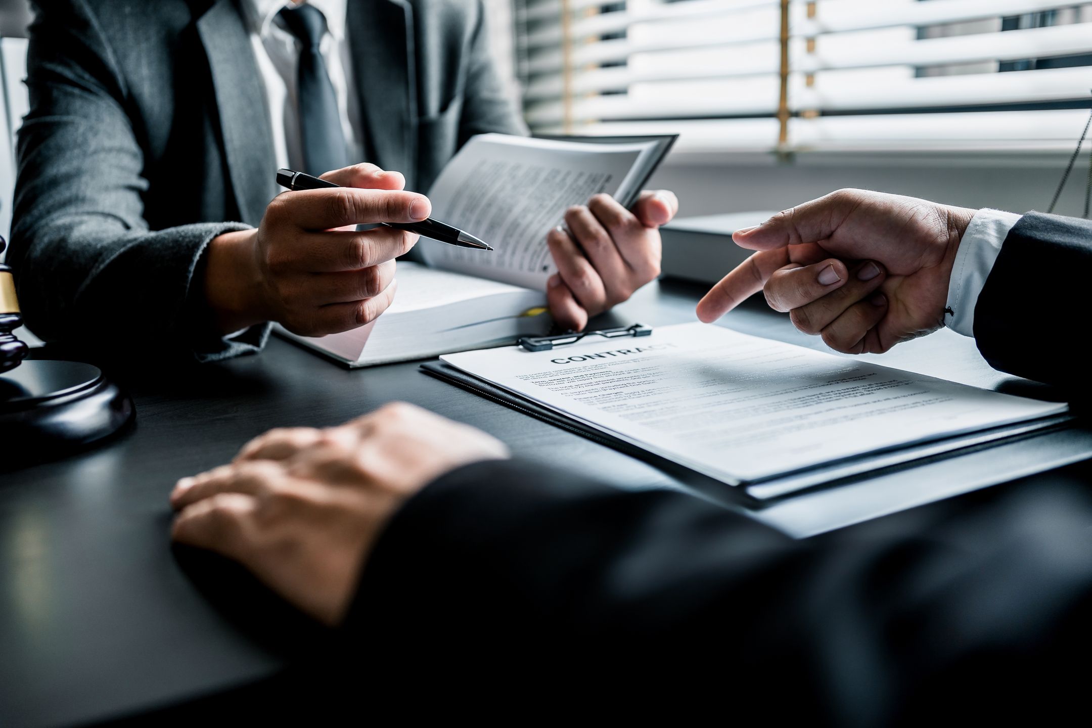 Close up of businessmen or lawyers discussing contract or business agreement at law firm office, Business people making deal document legal, justice advice service concept.
advice, adviser, agreement, attorney, business, businessman, client, collaboration, concept, consult, consultant, contract, corporate, courtroom, criminal, deal, discussion, document, employment, finance, financial, gavel, guidance, information, insurance, judge, judgement, justice, law, lawyer, legal, legislation, loan, man, manager, meeting, mortgage, office, official, paperwork, pen, people, person, professional, service, signature, signs, togetherness, working, write