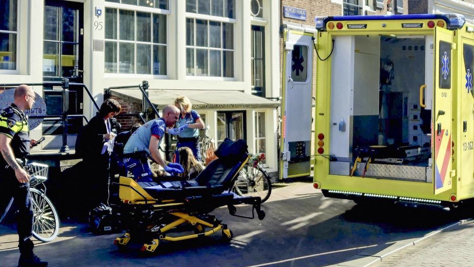 Temporary
Medical staff assist one of the five person that were wounded during a stabbing attack in Amsterdam on March 27, 2025. A suspect was placed into custody. Police said they had erected a cordon around the area the stabbing took place, near the central Dam Square. "We currently have no information about the cause or motive of the stabbing incident. This is part of our investigation," police said in a statement. There was no immediate information on the condition of those wounded. (Photo by various sources / AFP) / Netherlands OUT
-