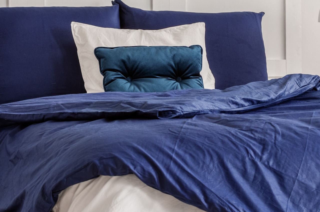 This color of the bedding in the man's bedroom is a warning sign.