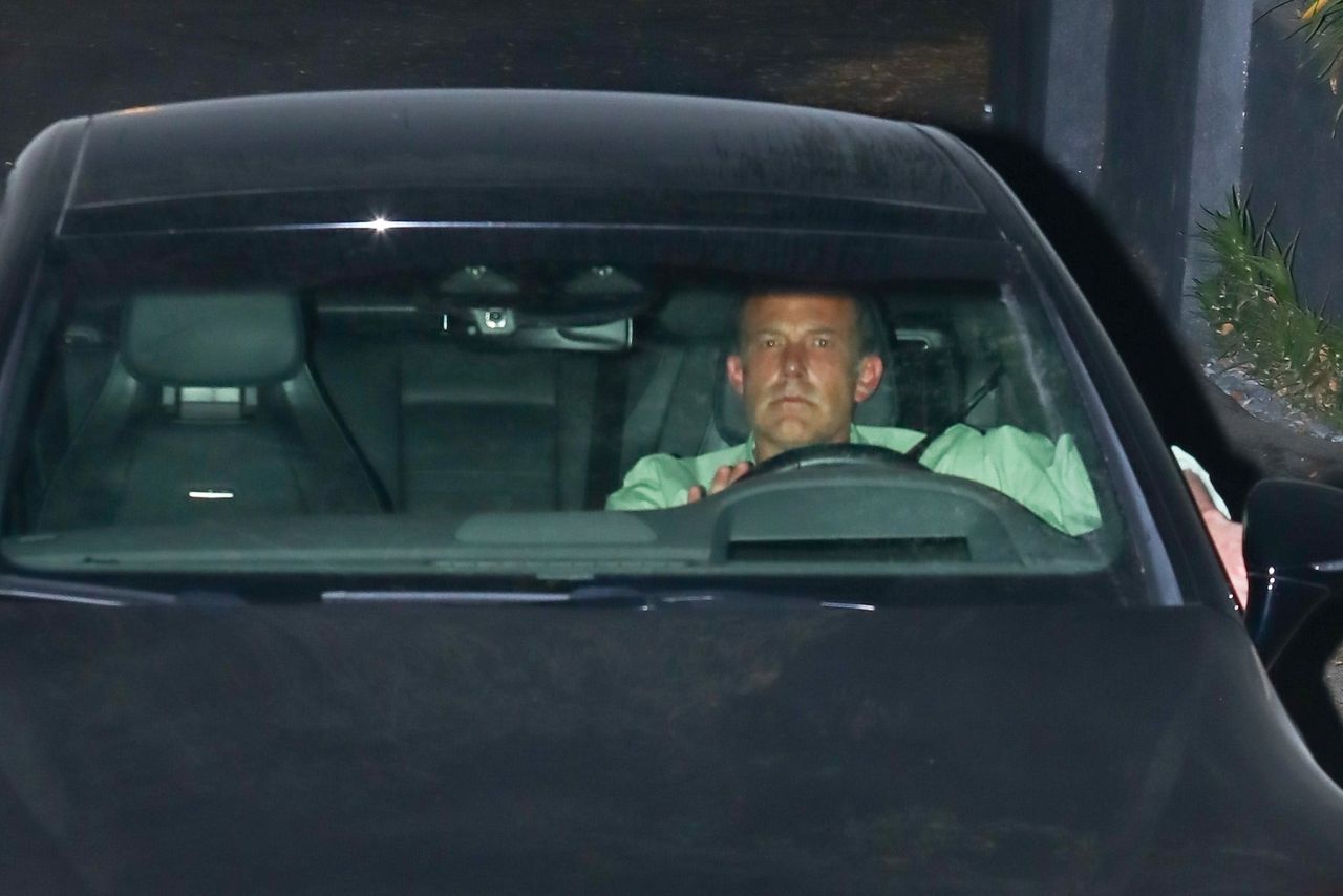 Ben Affleck with a sullen face leaves a meeting with JLo