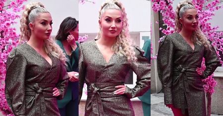 Poważna Cleo rzuca zimne spojrzenia w kierunku paparazzi