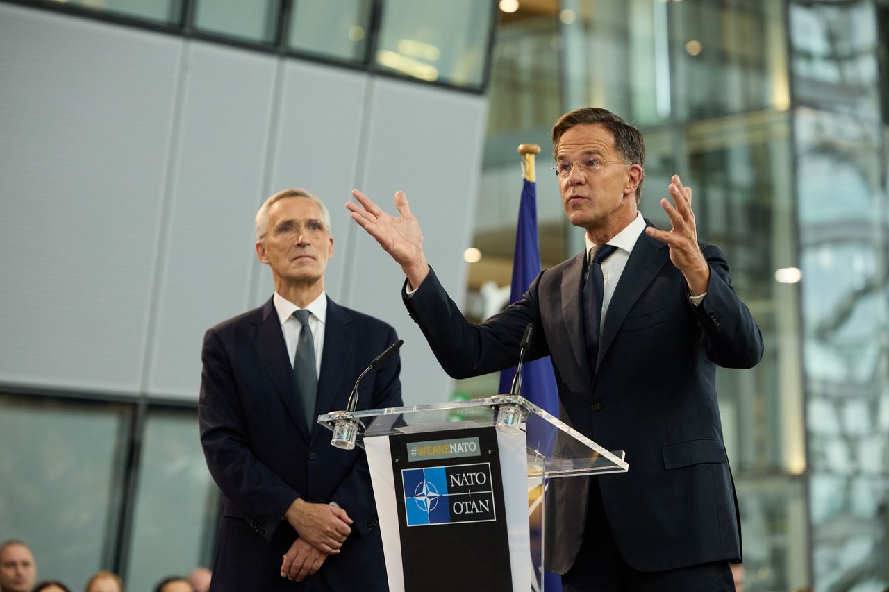 Jens Stoltenberg, outgoing secretary general of the North Atlantic Treaty Organization (NATO), left, and Mark Rutte, incoming secretary general of the North Atlantic Treaty Organization (NATO), during a transition ceremony at the NATO headquarters in Brussels, Belgium, on Tuesday, Oct. 1, 2024. Mark Rutte, the affable and meticulousformer Dutch premier, has a daunting task ahead to keep the defense alliance a global force. Photographer: Ksenia Kuleshova/Bloomberg via Getty Images