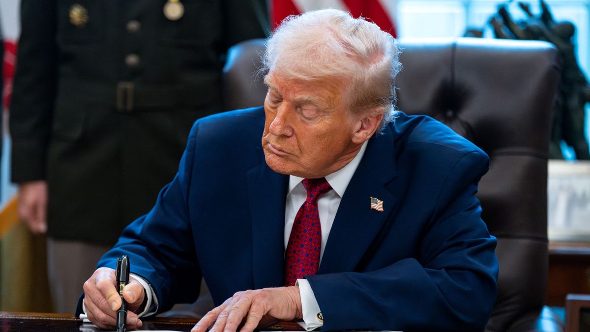 US President Donald Trump signs an executive order during a Mexican Border Defense medal presentation in the Oval Office of the White House in Washington, DC, US, on Monday, Dec. 15, 2025. Trump said he was classifying fentanyl as a "weapon of mass destruction" in his latest push to ratchet up pressure on Latin America over drug trafficking. Photographer: Bonnie Cash/UPI/Bloomberg via Getty Images