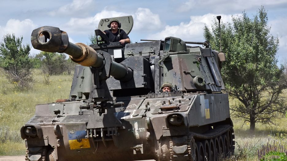 ORIKHIV, ZAPORIZHZHIA, UKRAINE - 2024/06/25: Ukrainian crew of the 155mm self-propelled howitzer M109 Paladin of the 118th Separate Mechanised Brigade drive a howitzer near the frontline in Zaporizhzhia region. The USA announces the beginning of a new offensive by the Russian army. According to the American Institute for the Study of War, it currently records all the signs that Russia is launching a new large-scale summer offensive on the territory of Ukraine. (Photo by Andriy Andriyenko/SOPA Images/LightRocket via Getty Images)