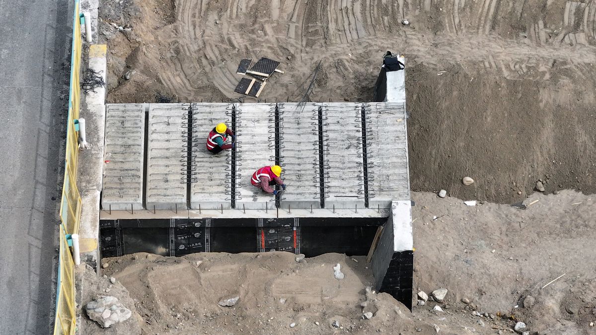 HAMI, CHINA- MARCH 30: Workers work at a construction site of the Hami section of the G30 Lianyungang-Khorgas Expressway on March 30, 2025 in Hami, Xinjiang Uygur Autonomous Region of China. The G30's traffic efficiency will increase by 30 percent after the expansion, injecting new momentum into the middle section of the economic corridors under the Belt and Road Initiative. (Photo by Sun Jihu/VCG via Getty Images)