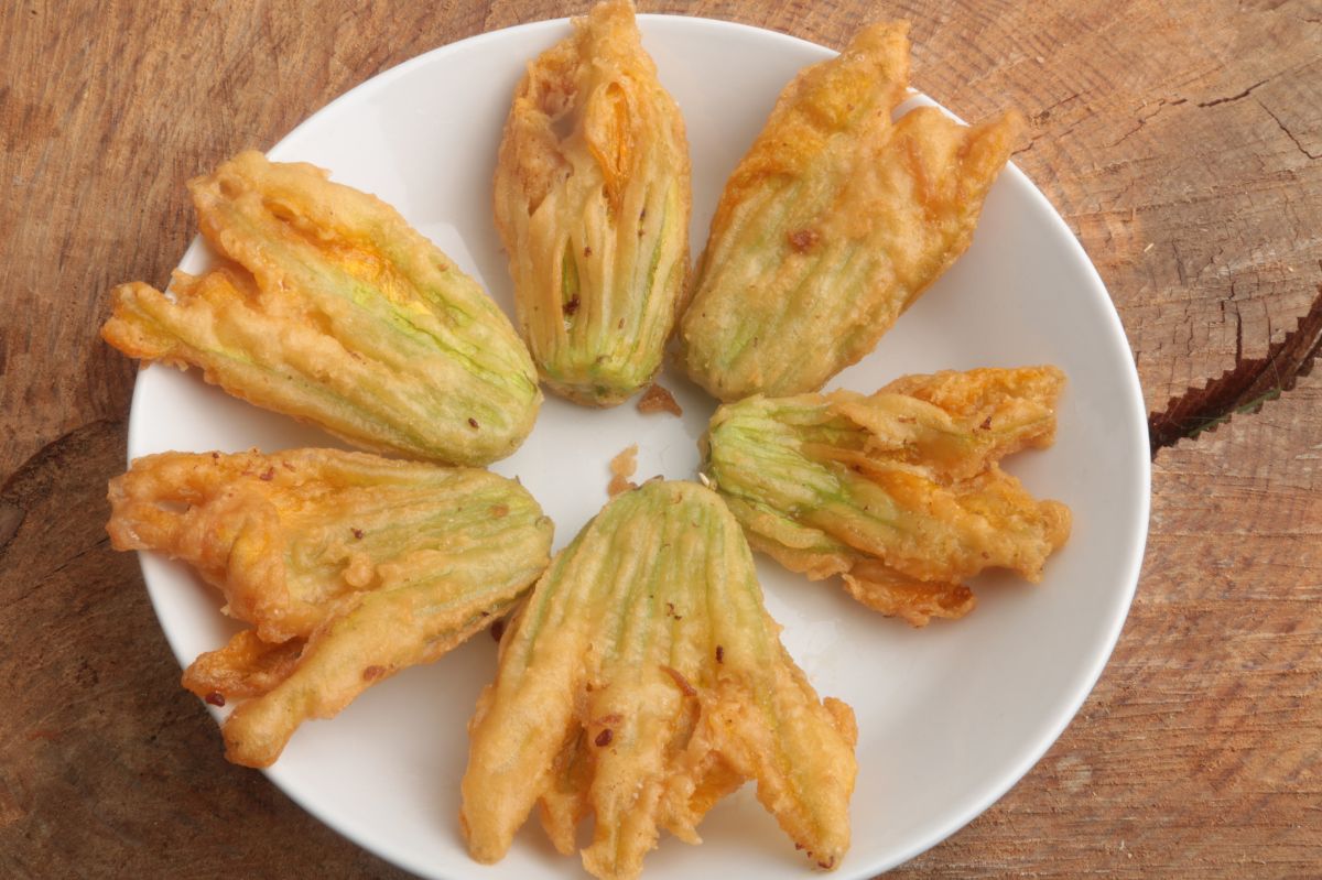 Granny dips these flowers in batter and fries them. It's a snack everyone waits for in the summer.