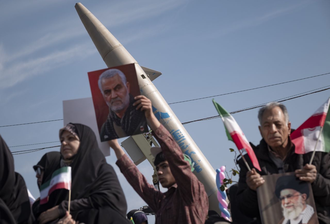 A man carries a photo of Qasem Soleimani, the commander of al-Quds, a special unit within the structure of the Islamic Revolutionary Guard Corps, killed in an American attack in Baghdad.