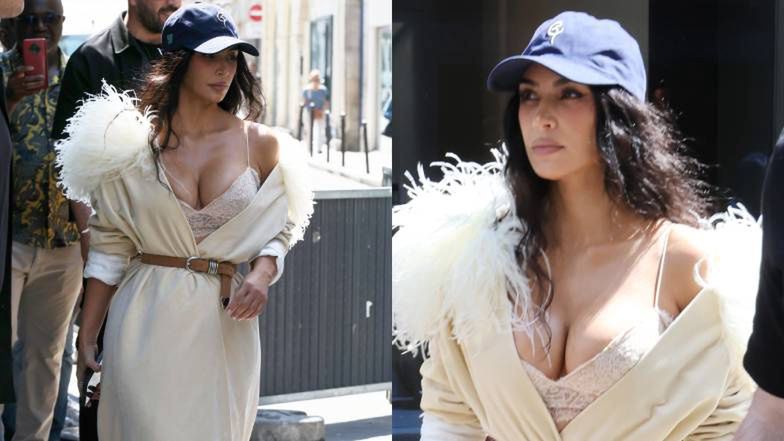 Rozchełstana Kim Kardashian w beżowym szlafroku wymyka się z paryskiego hotelu