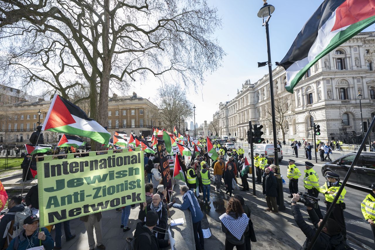 LONDON, UK - MARCH 24: People stage a demonstration against Israeli Prime Minister Bemjamin Netenyahu at Downing Street during his visit to London, United Kingdom on March 24, 2023. (Photo by RaÅid Necati AslÄ±m/Anadolu Agency via Getty Images)