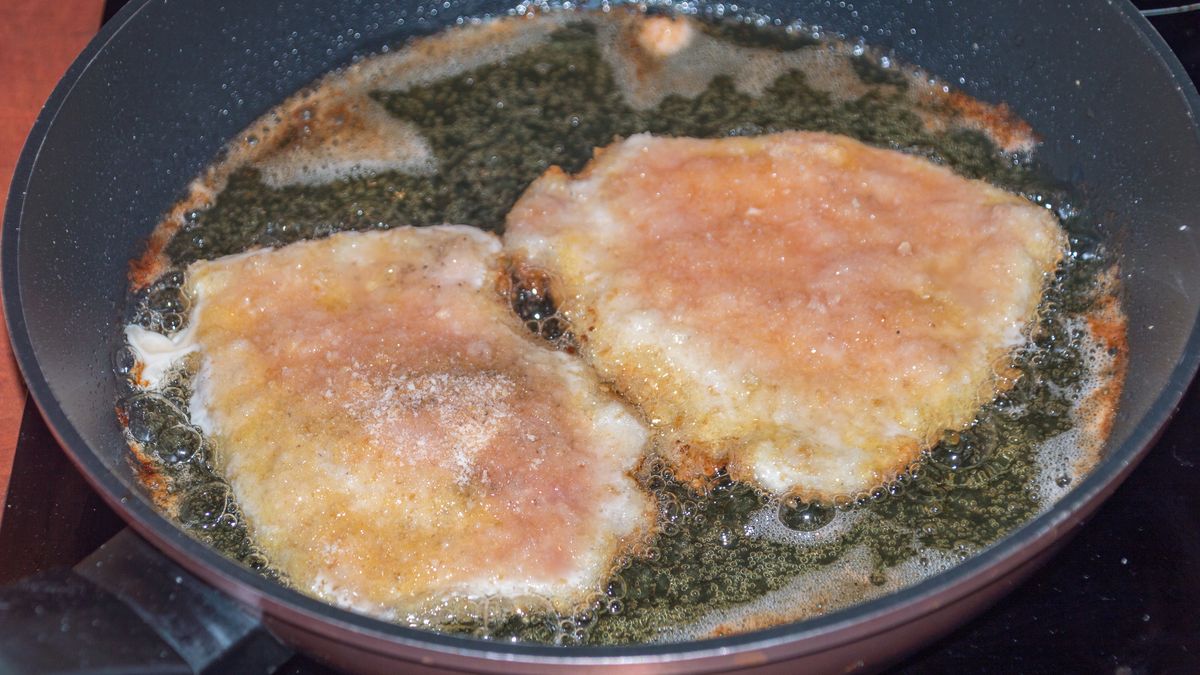 Frying Kotlet schabowy, Polish variety of pork breaded cutletchop, colors, cuisine, cutlet, dinner, dish, fennel, food, fried, fry, frying, kotlet, meal, meat, pan, poland, polish, pork, red, schabowy, shabovy, tasty, traditional, viennese, yellow, chop, colors, cuisine, cutlet, dinner, dish, fennel, food, fried, fry, frying, kotlet, meal, meat, pan, poland, polish, pork, red, schabowy, shabovy, tasty, traditional, viennese, yellow