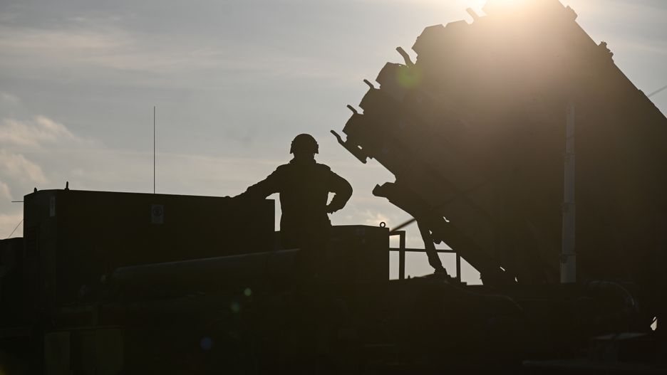 JASIONKA, POLAND - JANUARY 23: A german soldier stands on the top of a truck as he and others unload the US made MIM-104 Patriot surface-to-air missile (SAM) system on January 23, 2025 in Jasionka, Poland. Germany recently redeployed a Patriot air defense system in Poland, its NATO ally. (Photo by Omar Marques/Getty Images)
