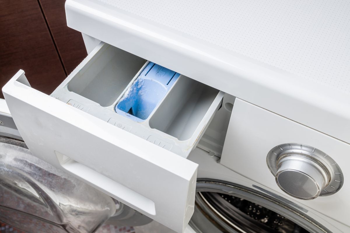 What is the third compartment in the washing machine drawer for?
