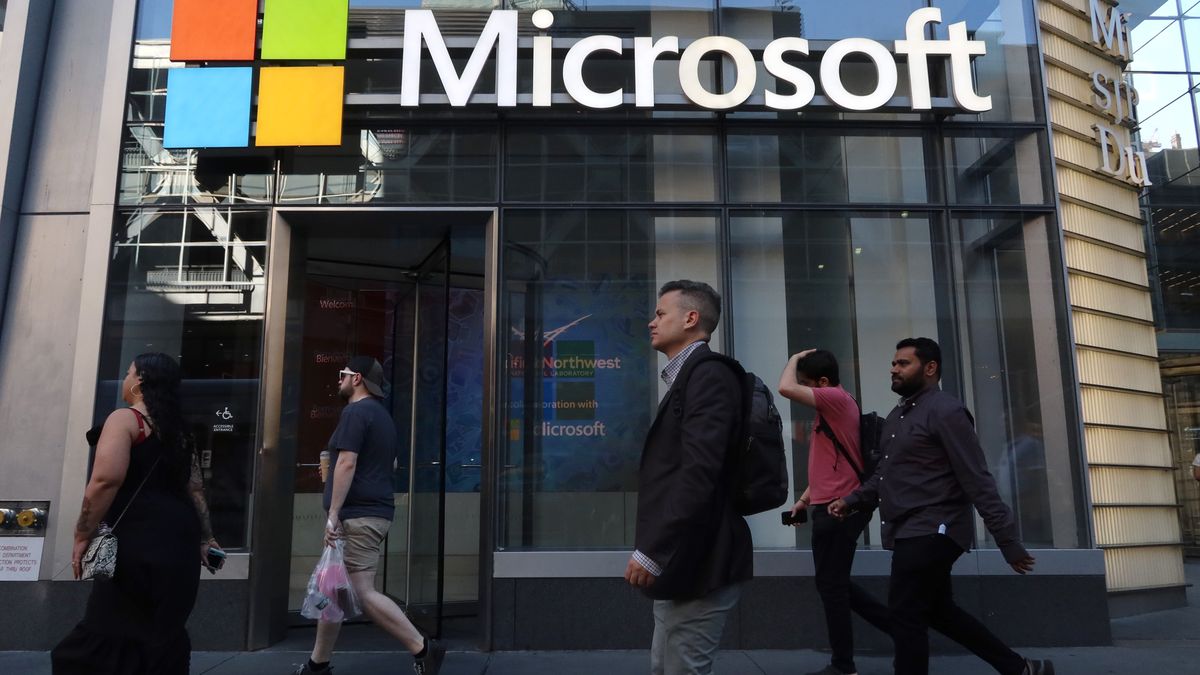 NEW YORK, NY - JUNE 24: People walk past the front entrance to a Microsoft office building on 8th Avenue on June 24, 2025, in New York City. (Photo by Gary Hershorn/Getty Images)