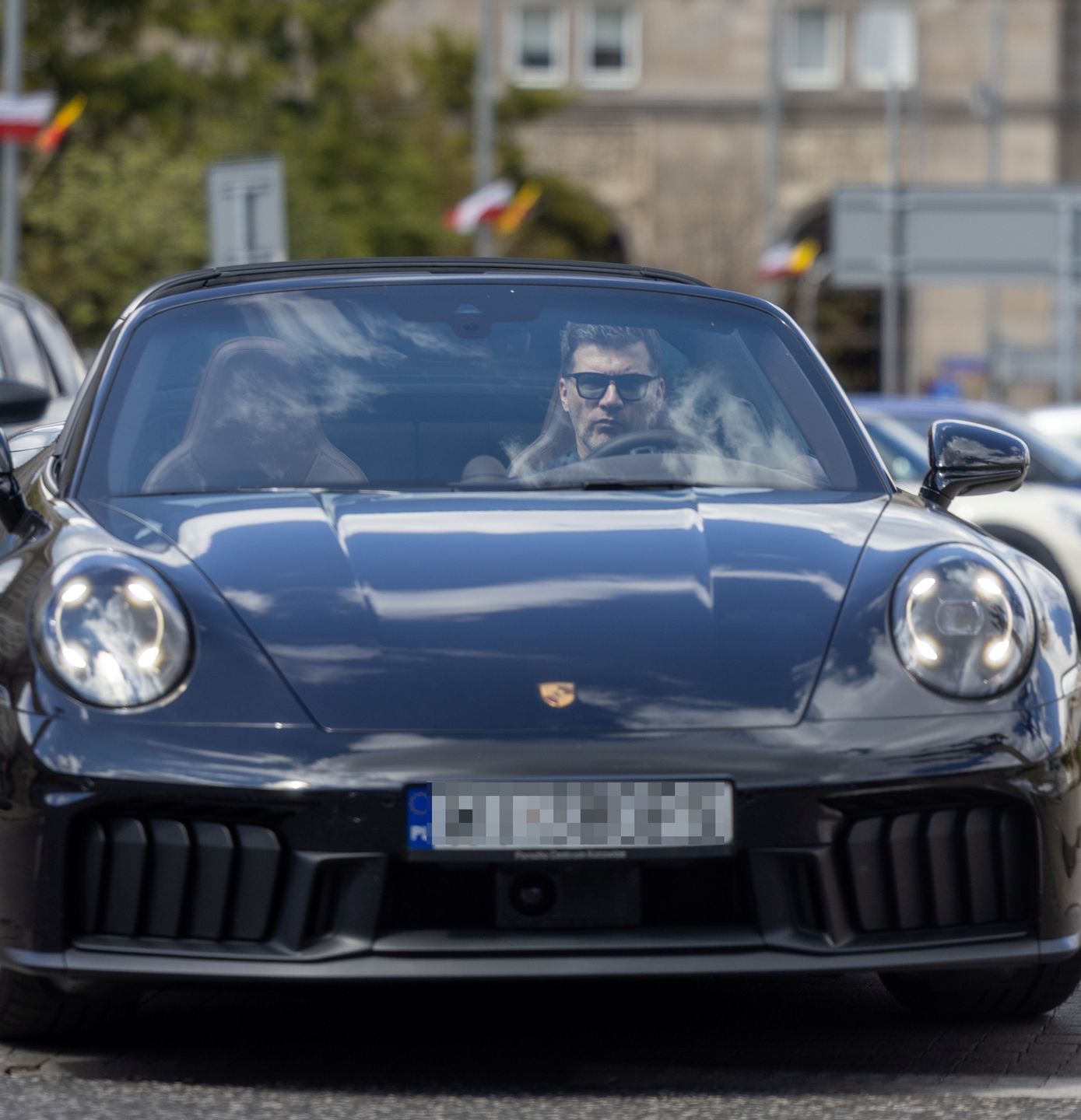 Tomasz Kammel wozi się porsche