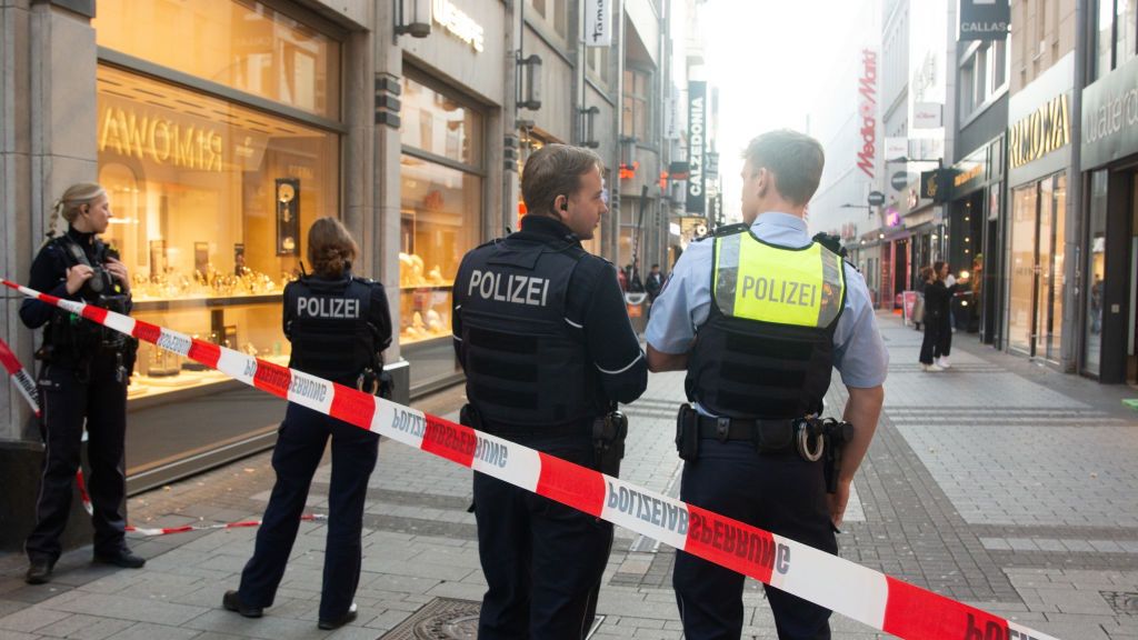 Knife Attack In Cologne City Center
Police block the site at a shopping area after a knife attack in the city center of Cologne, Germany, on October 10, 2024. (Photo by Ying Tang/NurPhoto via Getty Images)
NurPhoto
oct.10.2024, police, local authorities, safety measures, investigation, deutschland, site, media coverage, blocking, european city, suspect, public space, nur photo, city center, eyewitness, koeln, emergency response, knife attack, ying tang, nurphoto, law enforcement, threat, police presence, security perimeter, urban area, public safety, incident, yingphotography, shopping area