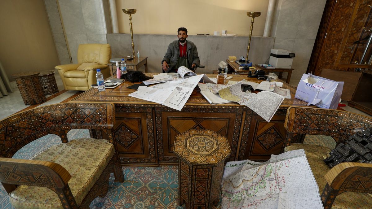TemporaryA Syrian opposition fighter sits inside an office at the Presidential Palace after the Syrian government collapsed in Damascus, Syria, Sunday, Dec. 8, 2024. (AP Photo/Omar Sanadiki)Omar Sanadiki