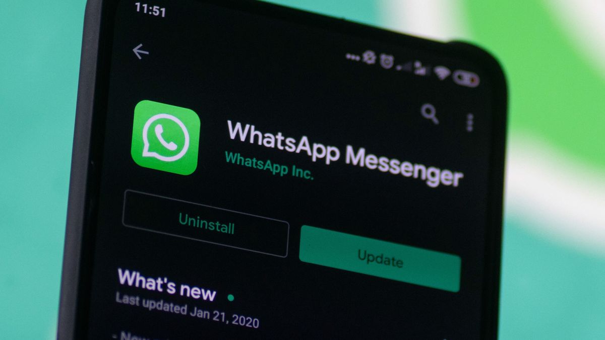 WhatsApp logo displayed on a phone screen, smartphone and keyboard are seen in this multiple exposure illustration. WhatsApp Messenger is a multiplatform mobile application that provides an encrypted instant messaging system belonging to Facebook, photo taken in Amsterdam, Netherlands on January 28, 2020 (Photo illustration by Nicolas Economou/NurPhoto via Getty Images)