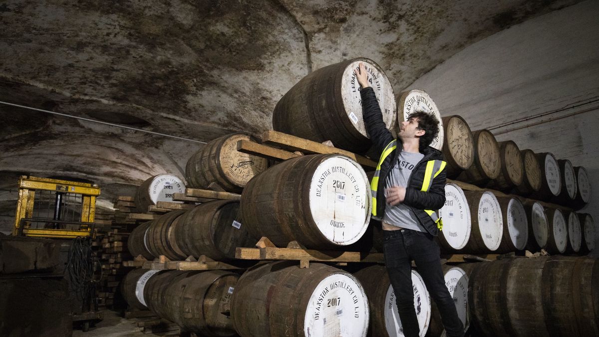 Ronnie Brodie at Deanston Distillery in Doune, checks the casks of their Highland Single Malts. (Photo by Jane Barlow/PA Images via Getty Images)
