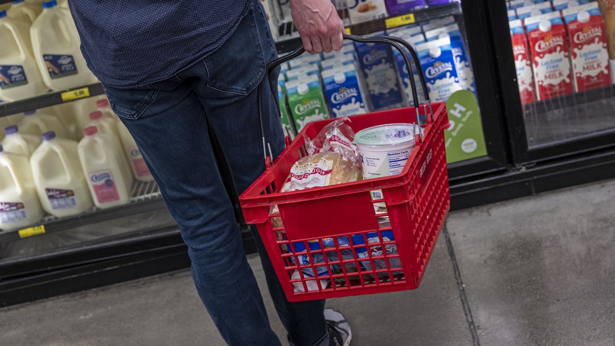 A customer holds a basket while shopping at a grocery store in San Francisco, California, U.S., on Thursday, Nov. 11, 2021. U.S. consumer prices rose last month at the fastest annual pace since 1990, cementing high inflation as a hallmark of the pandemic recovery and eroding spending power even as wages surge. Photographer: David Paul Morris/Bloomberg via Getty Images