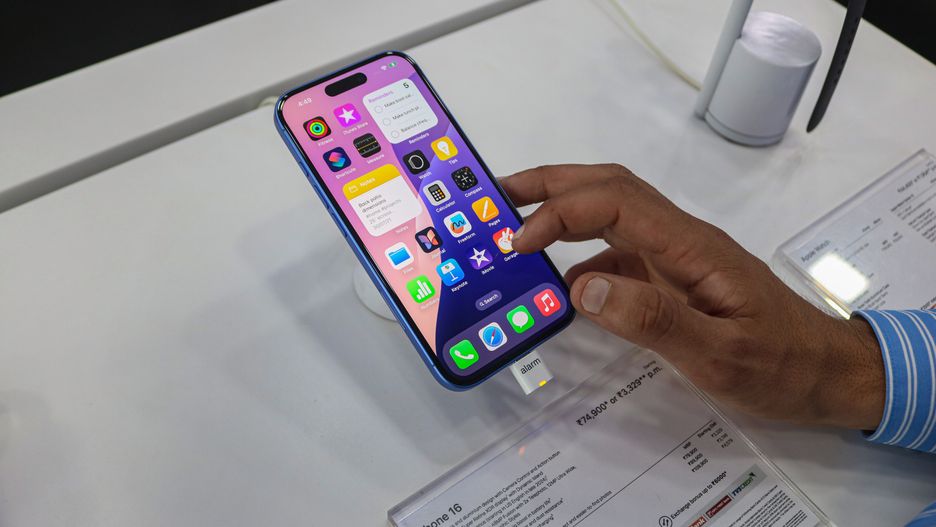 A customer checks Apple's latest iPhone 16 series displayed for sale at Master Arts Shop in Srinagar, Jammu and Kashmir, on September 26, 2024. According to Apple Inc, the new iPhone 16 features Apple Intelligence, the new platform for artificial intelligence (AI) capability, larger display sizes, new creative capabilities, and an innovative camera. (Photo by Firdous Nazir/NurPhoto via Getty Images)