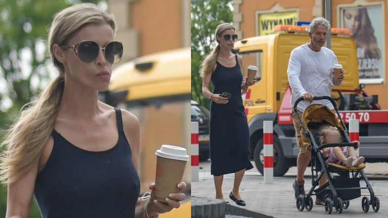 Joanna Krupa z kawą i smartfonem w ręce oprowadza męża i córeczkę po Warszawie