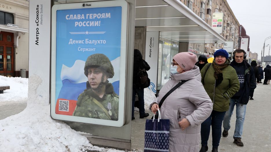 Daily Life In Moscow
MOSCOW, RUSSIA - DECEMBER 21: (RUSSIA OUT) A woman wearing a face mask looks at the billboard with a picture of Russian army sergeant Denis Balkhuto and a slogan that reads: "Glory to the heroes of Russia!", at the bus stop on December 21, 2022, in Moscow, Russia. Thousands of military propaganda billboards have appeared across Moscow since the start of Russia's invasion of Ukraine. (Photo by Contributor/Getty Images)
Contributor