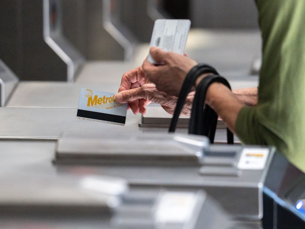 A commuter swipes a metro card at a subway station in New York, US, on Thursday, June 30, 2022. The head of New York's Metropolitan Transportation Authority warned the agency's anticipated $2 billion budget gap may widen in 2026 as it struggles to win back riders. Photographer: Jeenah Moon/Bloomberg via Getty Images