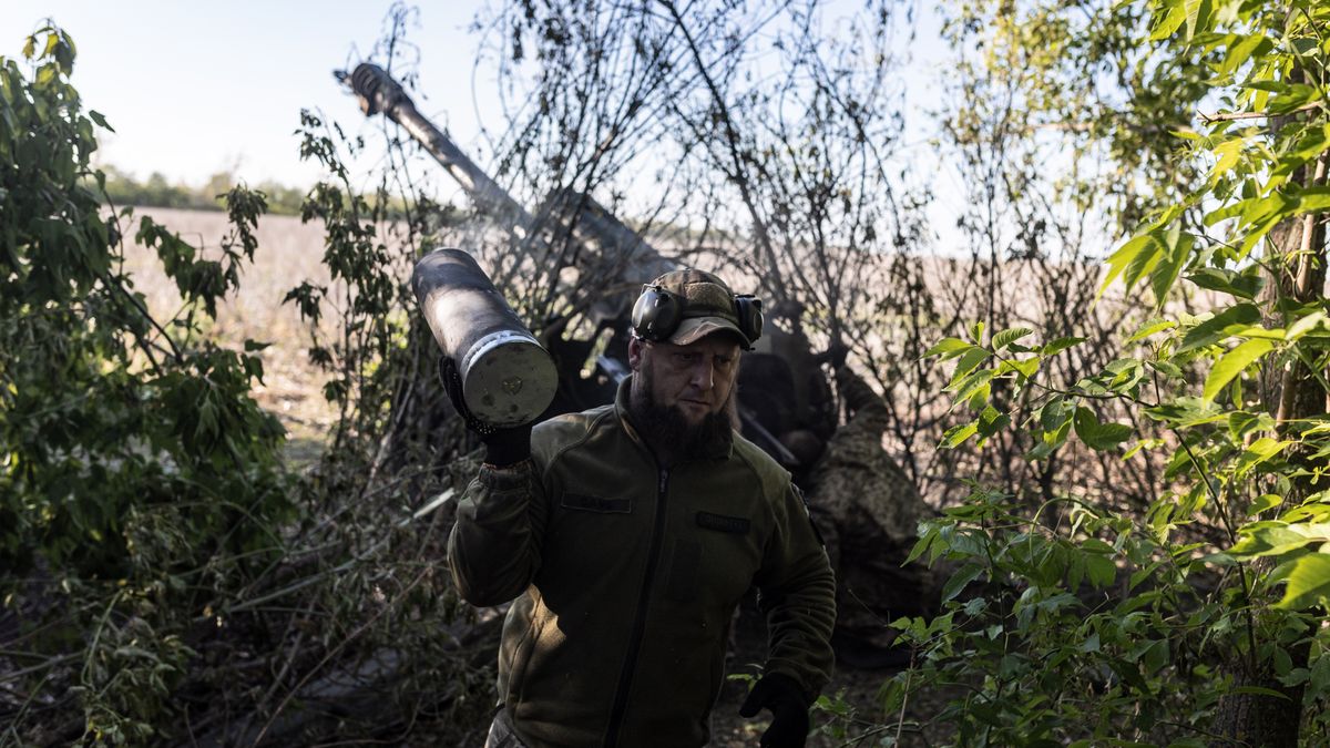 DONETSK OBLAST, UKRAINE - MAY 12: Ukrainian soldiers carry the remains of an explosive artillery charge at their fighting position in the direction of Chasiv Yar as the Russia-Ukraine war continues in Donetsk Oblast, Ukraine on May 12, 2024. (Photo by Diego Herrera Carcedo/Anadolu via Getty Images)