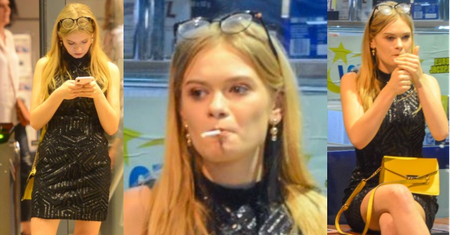 Wystrojona Julia Wróblewska PALI PAPIEROSA wieczorową porą