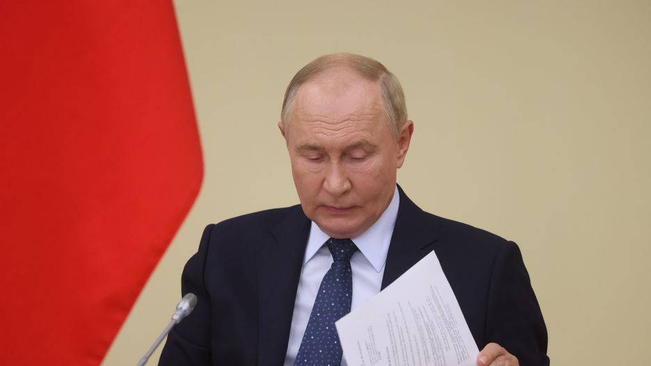 MOSCOW, RUSSIA - AUGUST 7: (RUSSIA OUT) Russian President Vladimir Putin looks at his papers during his meeting with minister at Novo-Ogaryovo State Residence on August 7, 2024, in Moscow, Russia. This week Putin called for Iran to limit damage in any relations against Israel. (Photo by Contributor/Getty Images)