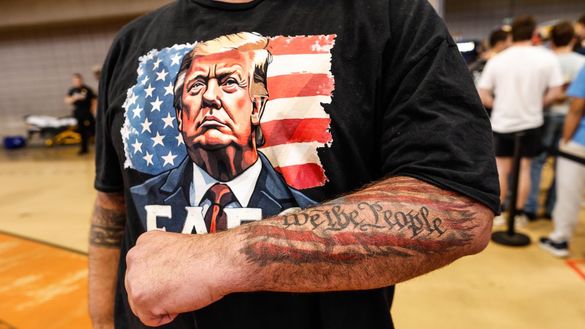 US President Trump delivers remarks in Suffren, New York
epa12985667 A supporter shows his tattoo as he waits for US President Donald Trump to arrive during an event on the economy at Rockland Community College Fieldhouse in Suffern, New York, USA, 22 May 2026.  EPA/KENA BETANCUR 
Dostawca: PAP/EPA.
KENA BETANCUR
Remarks, Rally, Trump Rally, US politics, MAGA
