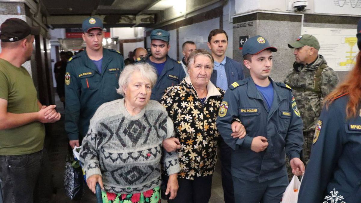 ORYOL, RUSSIA - AUGUST 9: (----EDITORIAL USE ONLY - MANDATORY CREDIT - 'RUSSIAN MINISTRY OF EMERGENCY SITUATIONS / HANDOUT' - NO MARKETING NO ADVERTISING CAMPAIGNS - DISTRIBUTED AS A SERVICE TO CLIENTS----) Employees of the Russian EMERCOM help the people, who are forced to leave the border settlements, as they have arrived from the Kursk region at a railway station in Oryol, Russia on August 9, 2024. Authorities organized temporary accommodation, food, medical and informational support for more than 80 people, which 24 of them are children. Ukrainian army launched a full-scale attack on Russia's southern Kursk region, creating a new front in the conflict. (Photo by Russian Emergencies Ministry/Anadolu via Getty Images)
