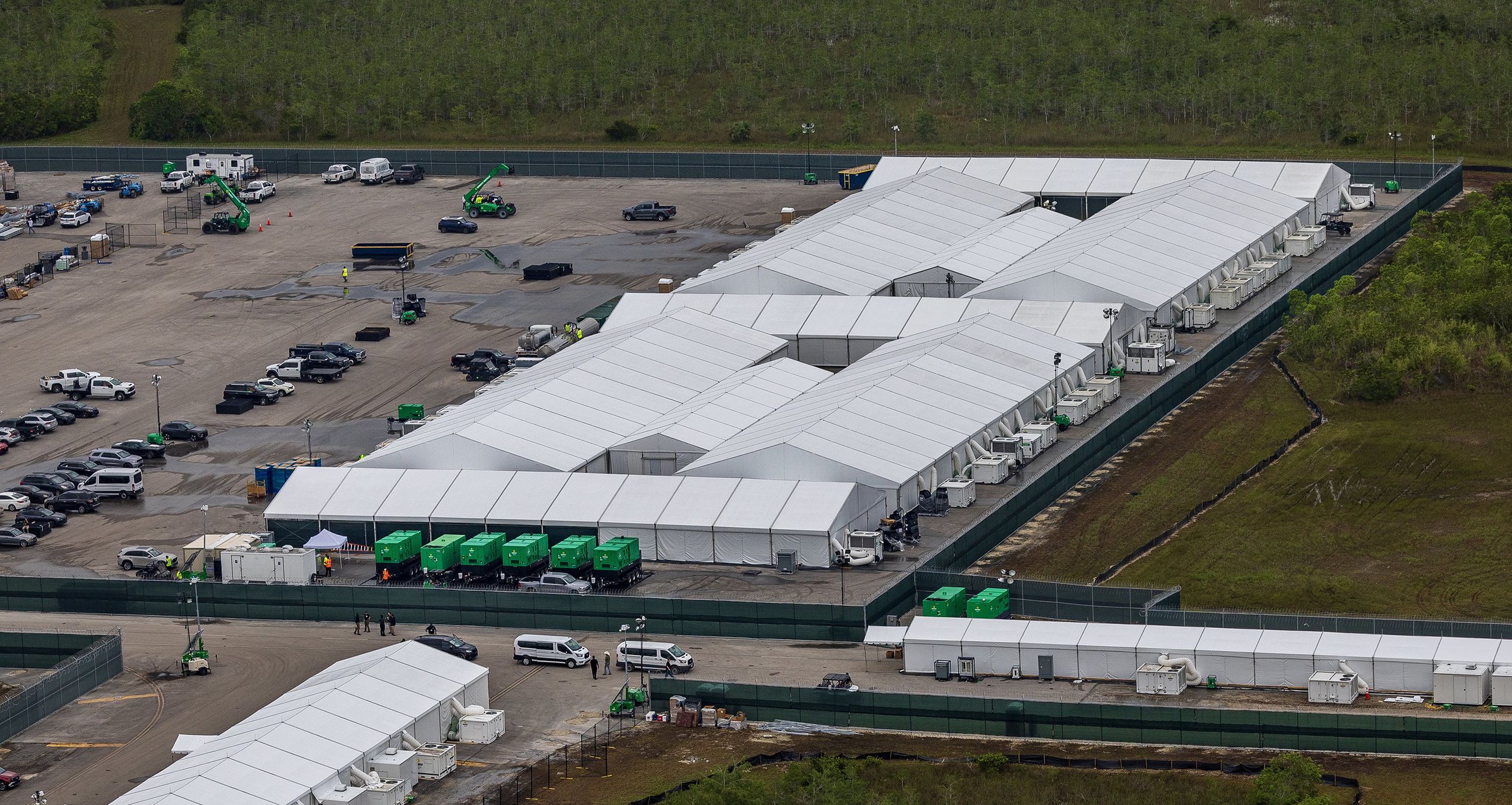 Aerial view of structures, including gigantic tents built at the recently opened migrant detention center Alligator Alcatraz, located at the site of the Dade-Collier Training and Transition Airport in Ochopee, Florida, on July 4, 2025. (Pedro Portal/Miami Herald/Tribune News Service via Getty Images)