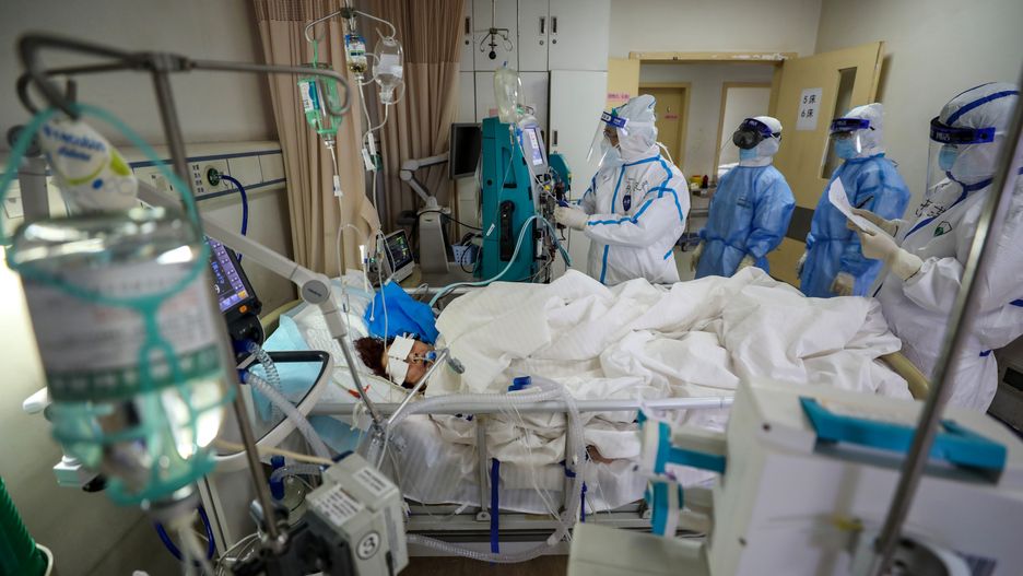 WUHAN, CHINA - MARCH 06 2020: Medical workers take care of a patient in critical conditions in a hospital designated for COVID-19 patients in Wuhan in central China's Hubei province Friday, March 06, 2020.- PHOTOGRAPH BY Feature China / Barcroft Studios / Future Publishing (Photo credit should read Feature China/Barcroft Media via Getty Images)