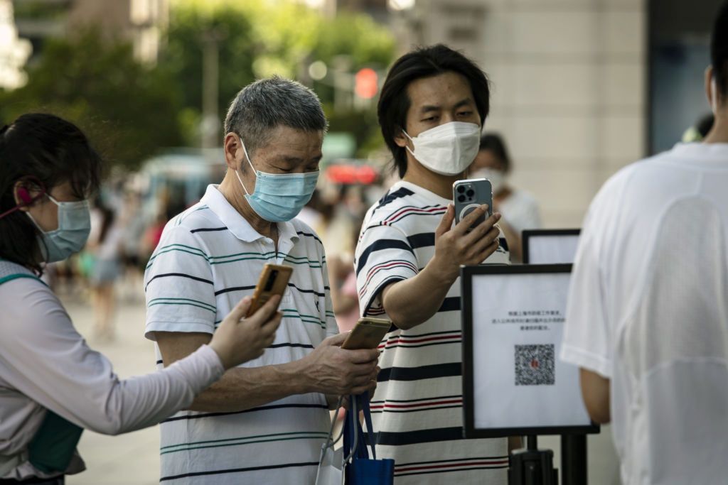 Covid Measures In Shanghai As China Covid Outbreaks WidenShoppers scan a QR code for Covid-19 contact tracing before entering a store in Shanghai, China, on Saturday, July 2, 2022. China's virus cases continued to climb over the weekend with hundreds of infections detected in Anhui province, where two counties were already in lockdown. Photographer: Qilai Shen/Bloomberg via Getty ImagesBloombergeast asian, communicable diseases, chinese, covid 19, pandemic, viral, shop, coronavirus2022, covid19, china, health, industries, disease, illness, consumer goods, bric countries, infectious diseases, business news