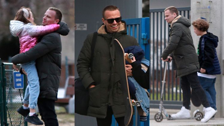 Marcin Hakiel dokazuje z dziećmi na placu zabaw