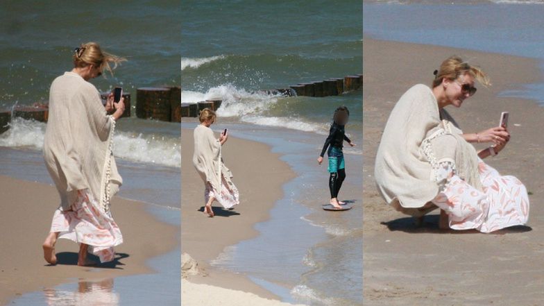 Anna Kalczyńska pije piwo na plaży i fotografuje pociechy