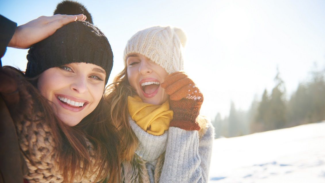 Funny friends playing with hats